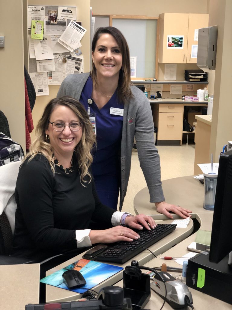 Red Deer College health-care management students Roxanne Hiebert (standing) and Andrea Luca are working on a project focusing on rural health-care recruitment and retention.