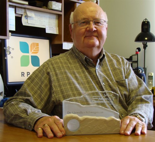 Larry Samoil with a prototype of the award he has sponsored since its inception.