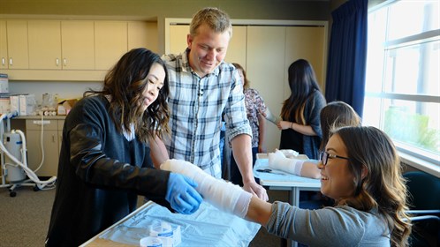 Here Dr. May teaches casting to healthcare students at an RPAP skills event in Manning