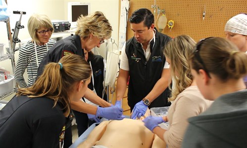 Dr. Gavin Parker provides guidance to one team at the Pincher Creek CARE Course
