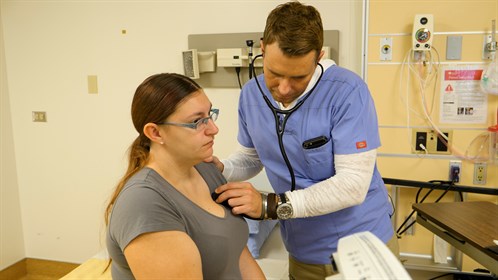 Dr Pieter Krog checks the breathing of patient Montana Graham.