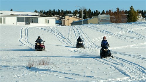 Snowmobiling is a popular pastime in Swan Hills.  Residents are allowed ride their sleds down town roads and alleys on their way to their favourite trail.