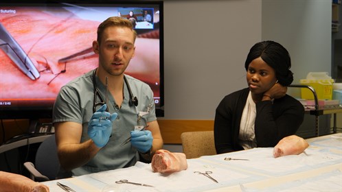 Darby Brox, a resident physician in Swan Hills, showed students the fine art of suturing.