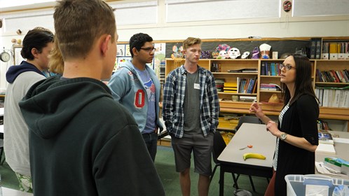 Kim Hartman, a physiotherapist, talks with students at her skills station. Kim graduated from Edgerton Public School in 2004.