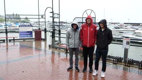 Students pose for a picture at the marina.