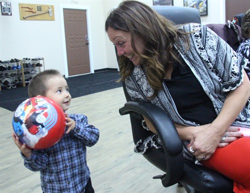 RhPAP’s Colleen Lindholm interacts with Michael Wang, son of Provost physician Dr. Jacky Wang.